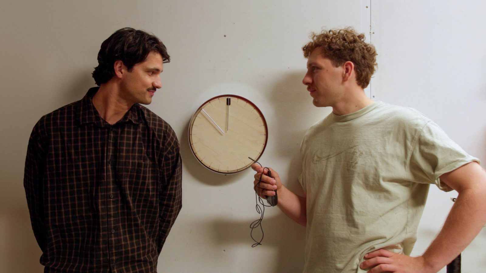 The two of us standing next to the clock we made